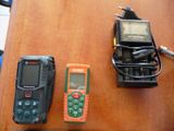 three different types of electronic devices on a table