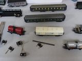 many different types of toy trains and cars on the table
