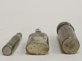 three different types of bullet shells on a white surface
