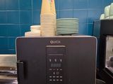 a microwave that is sitting on a counter in a kitchen