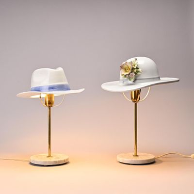 two hats that are sitting on top of a table