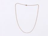 a gold chain necklace on a white background