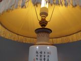 a lamp that has a chinese writing on it