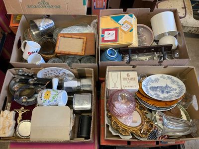 two boxes of assorted items sitting on a table