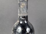 a bottle of wine that is sitting on a table