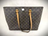 a louis vuitton handbag on a white background