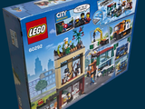 a box that has a lego city set inside of it