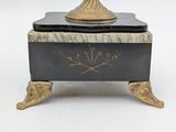 a black and gold box with a clock on top of it