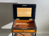 a small wooden box sitting on top of a table
