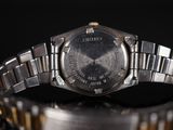 a close up of a wrist watch on a table