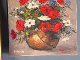 a painting of a vase of flowers on the wall