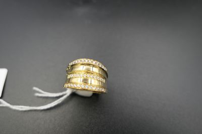 a close up of a ring on a string with a tag