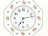 a clock that is hanging on the wall with flowers