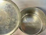 two pots and a pan sitting on a table