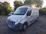 a silver van that is parked in a parking lot