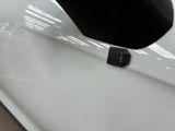 a close up of a white car with a black door handle