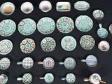 many different types of pottery on a black table