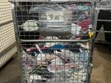 a cart with a lot of clothes in it