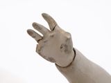 a statue of a hand holding something in the air
