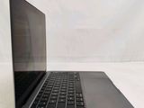 an open laptop computer sitting on top of a white table