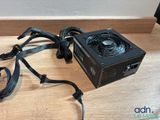 a close up of a computer power supply sitting on a table
