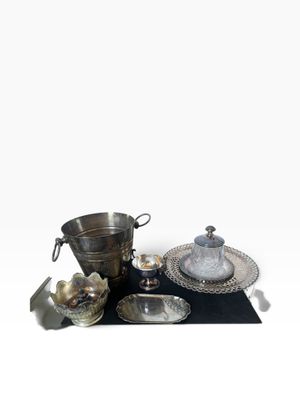 a lot of silver items that are on a table