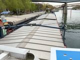 a boat that is sitting on the water next to a bridge