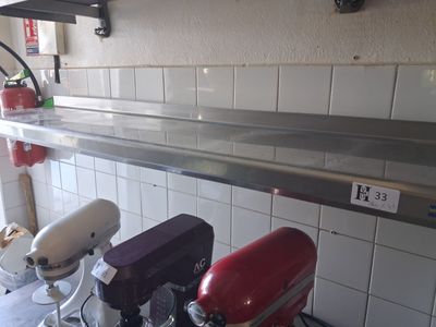 three mixers on the counter in the kitchen