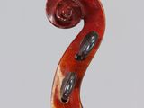 a close up of the back of a violin with a wooden bow