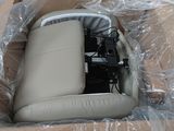 a car seat in a box that is wrapped in plastic
