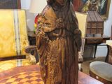 a statue of a woman on a table in a room