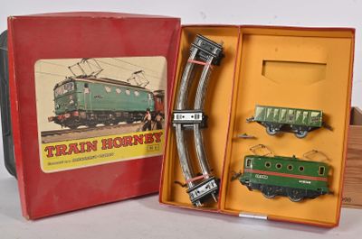 a train set in a box with a train on the tracks