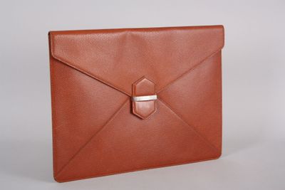 an image of a brown leather envelope with a metal clasp