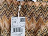 a close up of a label on a dress on a hanger