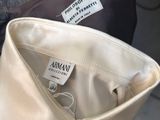 a close up of a person holding a bag with a label on it