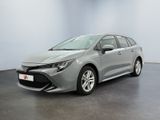 une Toyota Corollion grise garée dans une pièce blanche