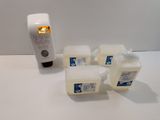 four containers of soap sitting on a table next to a hand sanitizer