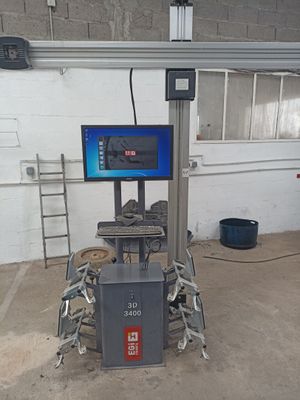 an image of a machine with a monitor on it in a garage