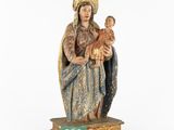 an image of a statue of a woman holding a baby