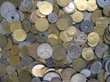a lot of coins that are on the table