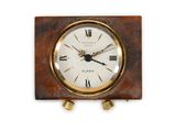a clock with roman numerals on the face of it
