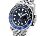 a close up of a watch on a bracelet on a white background