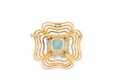 a close up of a gold and blue stone pendant on a white background