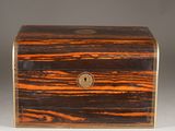 an antique wooden box with a lock on the front