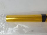 a yellow and black pen sitting on top of a plastic bag