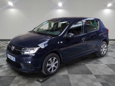 a blue car is parked in a room with a checkered floor