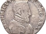 a close up of a silver coin with a man on it
