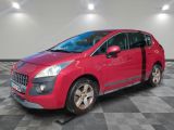 a red car is parked on a checkered floor in a garage