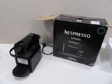 a box of nespresso coffee machines sitting on a table