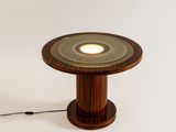 a wooden table with a lamp on top of it